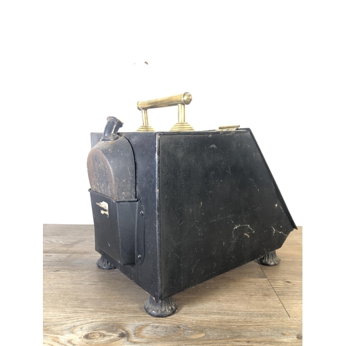 284 - An early 20th century hand painted black metal and brass coal scuttle with ceramic handled shovel - ... 