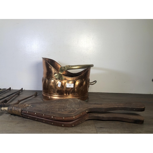 314 - Six vintage fireside accessories to include wood and leather fire bellows, copper coal scuttle, two ... 