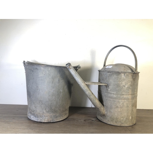 285 - Two vintage galvanised items, one watering can - approx. 46cm high and one bucket - approx. 43cm hig... 