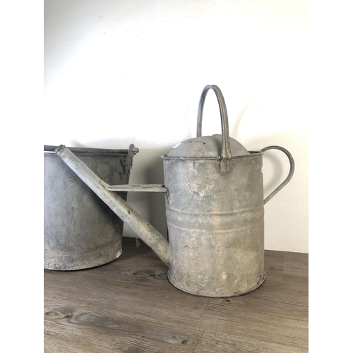 285 - Two vintage galvanised items, one watering can - approx. 46cm high and one bucket - approx. 43cm hig... 