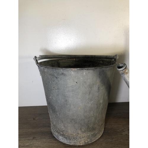 285 - Two vintage galvanised items, one watering can - approx. 46cm high and one bucket - approx. 43cm hig... 