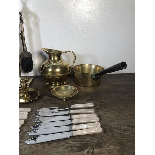 315 - A collection of metalware to include brass chamber stick, brass fireside companion set, Chromens She... 