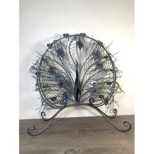 286 - A contemporary metal peacock tealight holder - approx. 66cm high x 64cm wide