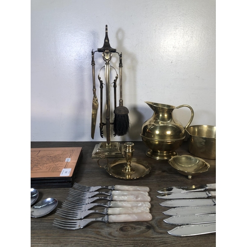 315 - A collection of metalware to include brass chamber stick, brass fireside companion set, Chromens She... 