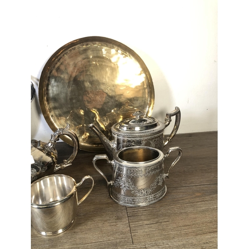 317 - A collection of metalware to include Shaw & Fisher Sheffield silver plated teapot, brass circular tr... 