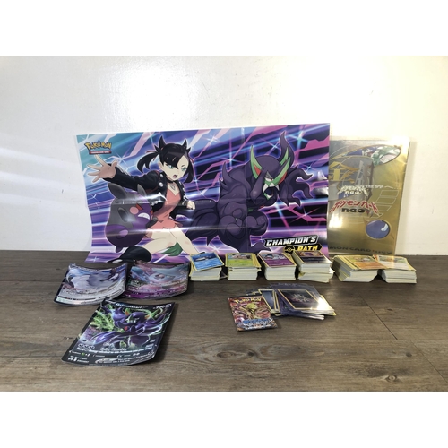 319 - A collection of Pokémon trading cards to include Japanese examples, Pokémon Card Neo folder etc.