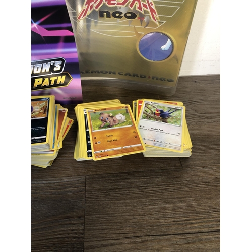 319 - A collection of Pokémon trading cards to include Japanese examples, Pokémon Card Neo folder etc.