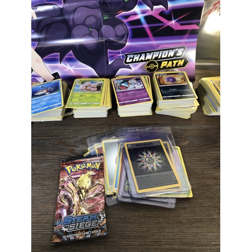 319 - A collection of Pokémon trading cards to include Japanese examples, Pokémon Card Neo folder etc.