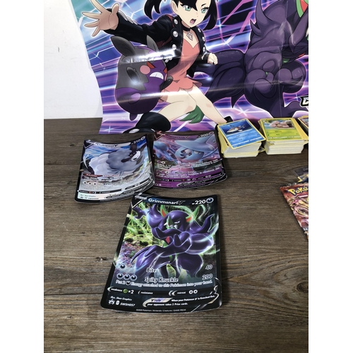 319 - A collection of Pokémon trading cards to include Japanese examples, Pokémon Card Neo folder etc.