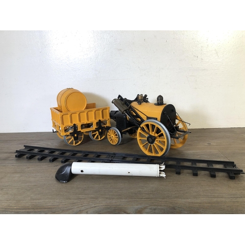 322 - A 1980s Hornby Stephenson Rocket locomotive and tender with two sections of track