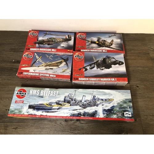 327 - A collection of model construction kits to include Airfix HMS Belfast, Airfix Hawker Hurricane MK.I,... 