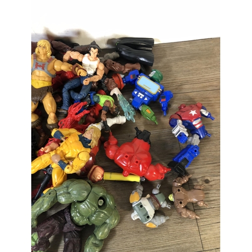 340 - A collection of plastic super hero figurines to include Spider Man, The Hulk etc.