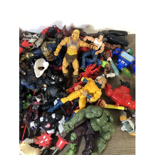 340 - A collection of plastic super hero figurines to include Spider Man, The Hulk etc.