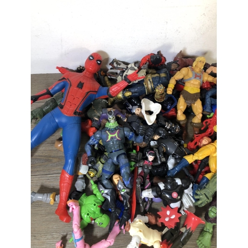 340 - A collection of plastic super hero figurines to include Spider Man, The Hulk etc.