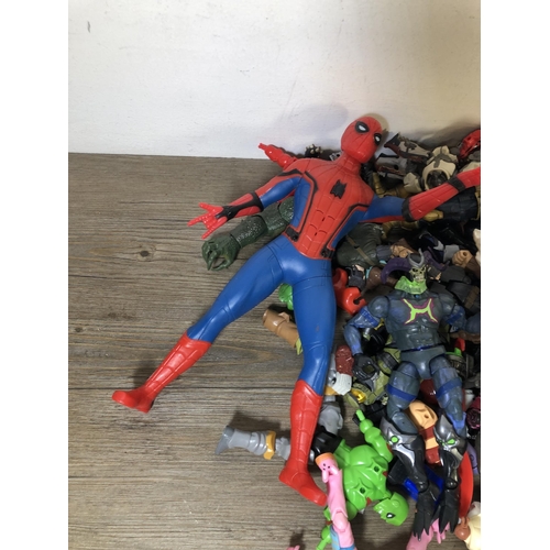 340 - A collection of plastic super hero figurines to include Spider Man, The Hulk etc.