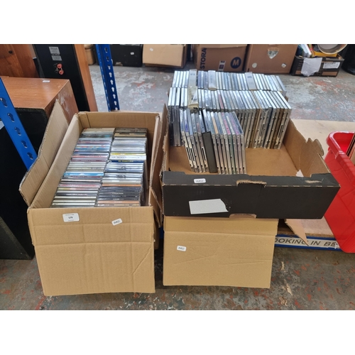 579 - Three boxes containing a collection of CDs to include Nirvana, The Verve, The Stone Roses, The Prodi... 