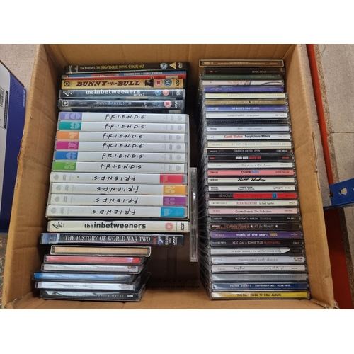 585 - A box containing a collection of CDs and DVDs; CDs to include George Benson, Diana Ross, Lionel Rich... 