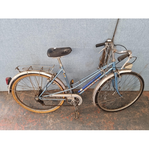 687 - A vintage Peugeot women's town bike with 3 speed gear system