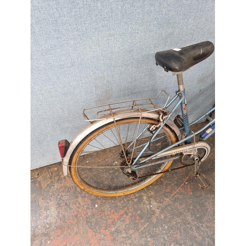 687 - A vintage Peugeot women's town bike with 3 speed gear system