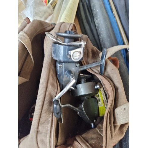 703 - A collection of fishing equipment to include floats, vintage Daiwa No. 730 reel etc.