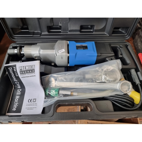 712 - A cased Premier Diamond Products PW162 core drill with instructions and accessories