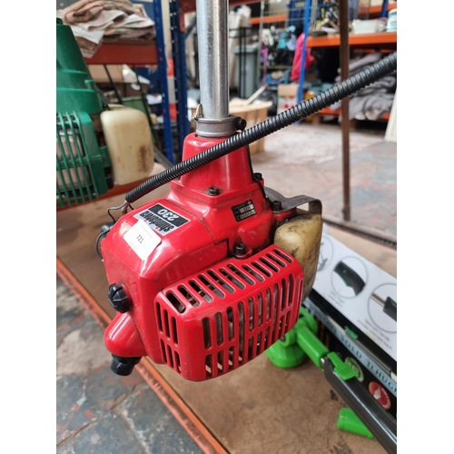 721 - A Shindaiwa 230 petrol strimmer