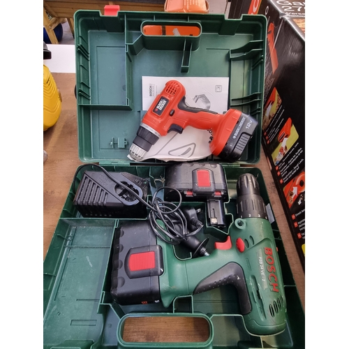 731 - Two items, one cased Bosch cordless 24v hammer drill with two batteries, charger and instruction man... 