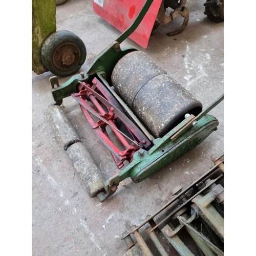 774 - An early/mid 20th century Greens cast metal lawnmower