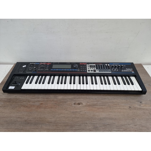 624 - A Roland Juno-Gi Synthesizer keyboard