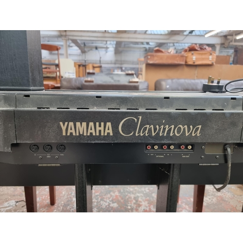 630 - A Yamaha Clavinova CVP-20 Electric Piano with Tannoy 623 speaker and duet stool containing sheet mus... 