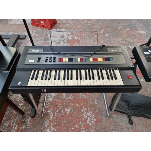 631 - A vintage Farfisa Bravo electronic home keyboard with stand