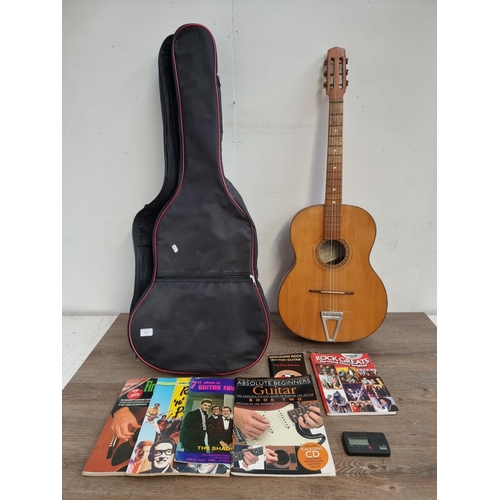 635 - A cased vintage Italian Di Stefano Antonino di Giuseppe acoustic guitar with sheet music and Korg el... 