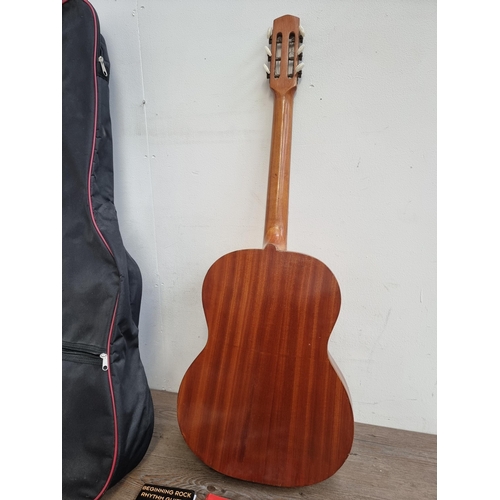 635 - A cased vintage Italian Di Stefano Antonino di Giuseppe acoustic guitar with sheet music and Korg el... 