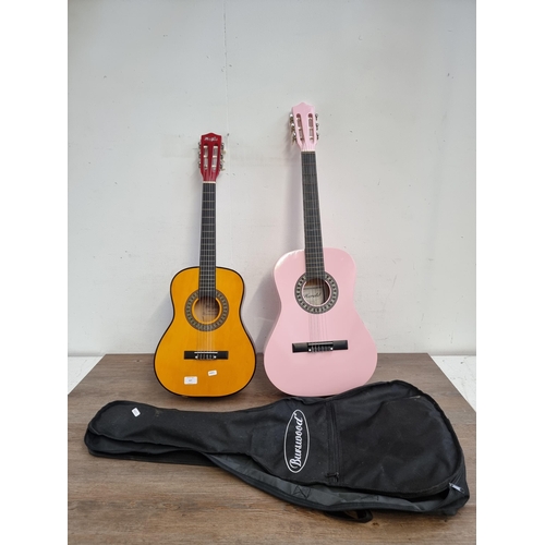 637 - Two child's nylon strung acoustic guitars, one cased pink Herald and one Music Alley