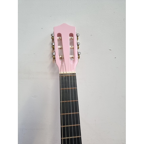 637 - Two child's nylon strung acoustic guitars, one cased pink Herald and one Music Alley