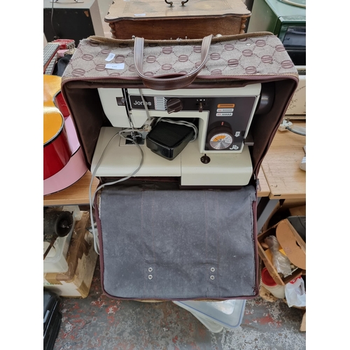 639 - A cased Jones VX520 electric sewing machine with foot pedal and instruction manual