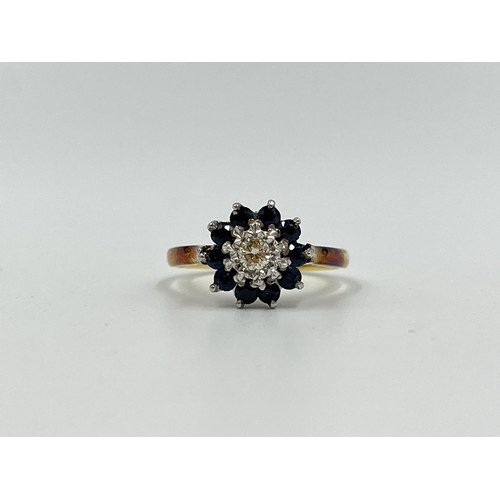 1082 - A hallmarked London 18ct gold sapphire and diamond cluster ring, dated 1967, size P - approx. gross ... 