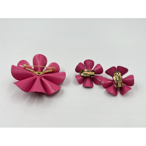 1085 - A mid 20th century pink plastic floral brooch and earrings set