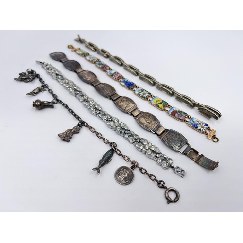 1091 - Five bracelets to include silver charm bracelet - approx. gross weight 16 grams etc.