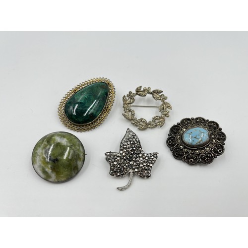 1093 - Five antique and vintage brooches to include CMP hallmarked Dublin silver and Connemara marble dated... 