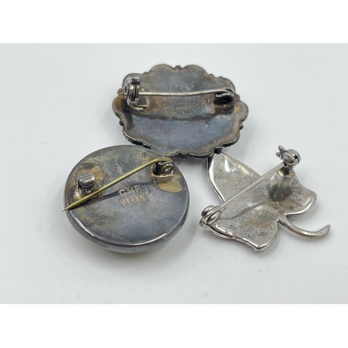 1093 - Five antique and vintage brooches to include CMP hallmarked Dublin silver and Connemara marble dated... 