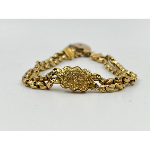 1096 - An Edwardian 9ct gold foliate etched bracelet with hallmarked Birmingham 9ct gold heart shaped padlo... 