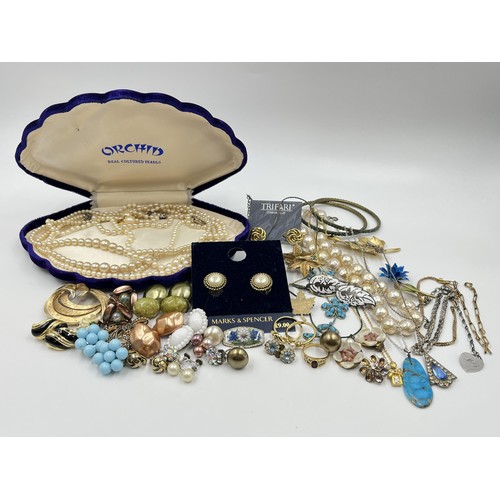 1102 - A collection of costume jewellery to include cultured pearl necklace with stamped 9ct white gold cla... 