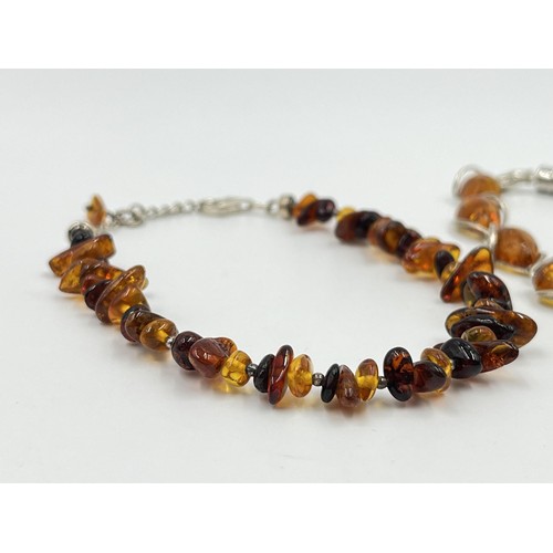 1106 - Two .925 silver and amber bracelets - approx. gross weight 18.47 grams