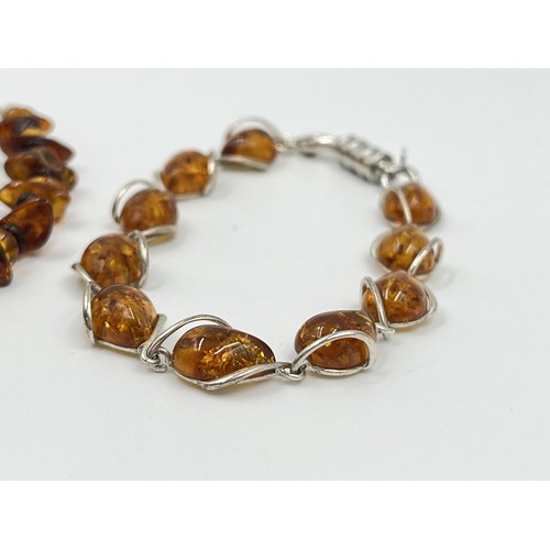 1106 - Two .925 silver and amber bracelets - approx. gross weight 18.47 grams