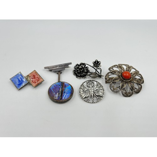 1107 - Five silver and white metal brooches to include Art Deco sterling silver and butterfly wing S. S. Br... 