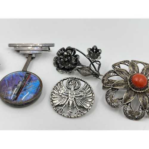 1107 - Five silver and white metal brooches to include Art Deco sterling silver and butterfly wing S. S. Br... 