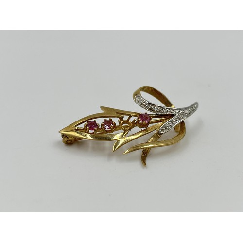 1110 - A hallmarked Birmingham 9ct gold ruby and diamond pin brooch - approx. gross weight 3.91 grams