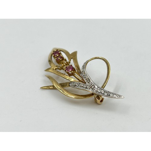 1110 - A hallmarked Birmingham 9ct gold ruby and diamond pin brooch - approx. gross weight 3.91 grams