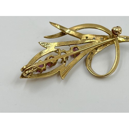 1110 - A hallmarked Birmingham 9ct gold ruby and diamond pin brooch - approx. gross weight 3.91 grams